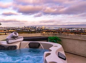 a hot tub on the roof of a building at Spacious Beautiful Home with Stunning Bay Views in San Diego