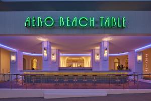 a building with a sign that reads ape racism table at THE SENAGAJIMA STORYLINE in Tomigusuku