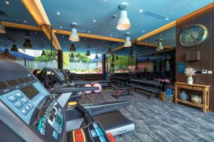 a gym with treadmills and a treadmill at Ashley Tugu Tani Menteng in Jakarta