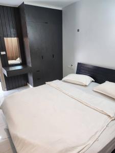 Postel nebo postele na pokoji v ubytování Pnd 아파트 702