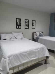 Letto o letti in una camera di Hotel Ocean Fusagasuga