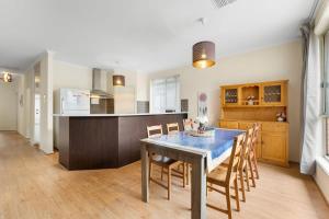 a kitchen and dining room with a table and chairs at 3BR Home-City Fringe Location-Free WiFi & Parking in Keswick