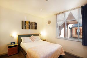 A bed or beds in a room at CBD premium location Studio