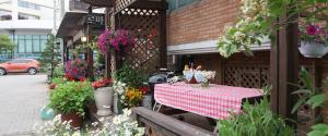 a table with a red and white checkered table cloth at Roma Pension Boryeong in Boryeong