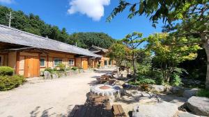 a group of benches in front of a building at Gapyeong Dume Mountain Pension in Gapyeong