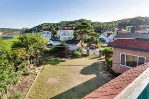 an aerial view of a house with a yard at Gyeongju Choice Kids Pension in Gyeongju