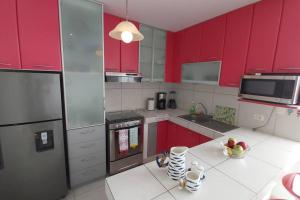 Kuchyň nebo kuchyňský kout v ubytování Departamento en playa Chocaya. Disfruta del mar, la piscina y la tranquilidad.