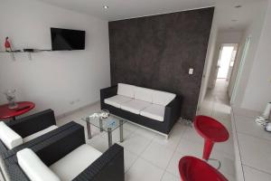 Posezení v ubytování Departamento en playa Chocaya. Disfruta del mar, la piscina y la tranquilidad.