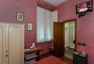 TV a/nebo společenská místnost v ubytování Hotel Rex