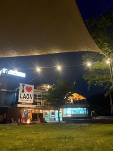 a building with a sign on it at night at Damyang Raon Glamping in Damyang