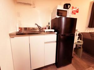Cucina o angolo cottura di Necoana Glamping富士山景BBQトレーラーヴィラ