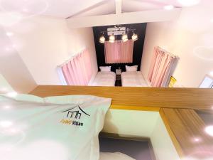 Letto o letti in una camera di Necoana Glamping富士山景BBQトレーラーヴィラ