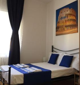 En eller flere senge i et værelse på The 7th Floor in Rome