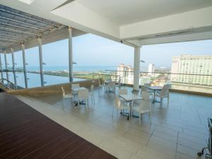 a view from the top of a building with tables and chairs at The Straits Melaka by Perfect Host in Melaka