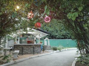 a house with a kitchen with lights in a tree at RedDoorz at Guimod Transient House Ilocos Sur in Bantay