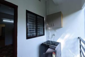 Kuchyň nebo kuchyňský kout v ubytování Lourels Stay + 11 fotografií