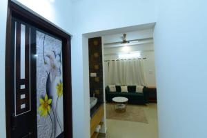 a room with a bathroom with a mirror at Lourels Stay in Udupi