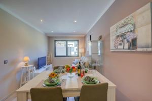a dining room with a table and chairs at 4 Seasons Apartment - Happy Rentals in Taverne