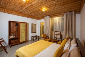 a bedroom with a large bed in a room at Country Club Nuwara Eliya in Nuwara Eliya
