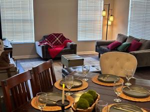 a dining room with two tables with wine glasses at Harry Potter Themed Luxury Apartment 3bd 2bth - Universal Studios in Orlando