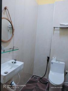 a bathroom with a sink and a toilet and a mirror at Shusimi Boutique Villa SG Near Tan Son Nhat Airport in Ho Chi Minh City