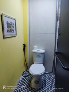 a bathroom with a white toilet in a room at Shusimi Boutique Villa SG Near Tan Son Nhat Airport in Ho Chi Minh City