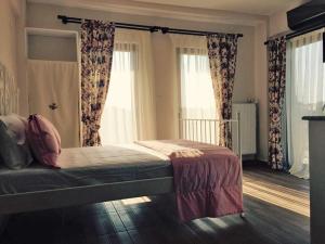 A bed or beds in a room at Ede Apart Otel