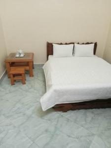 Ένα ή περισσότερα κρεβάτια σε δωμάτιο στο PHƯƠNG ĐÔNG VILLA - MỘC CHÂU