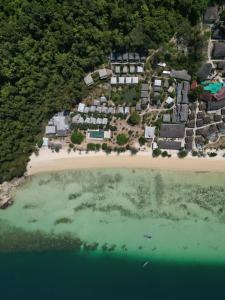 an aerial view of a resort on a beach at Thanya Beach Resort - SHA Plus in Ko Ngai