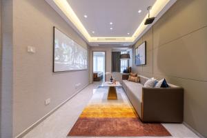 Area soggiorno di Excellence International Apartment - Convention & Exhibition Center