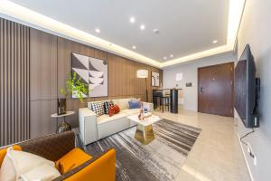 TV o dispositivi per l'intrattenimento presso Excellence International Apartment - Convention & Exhibition Center