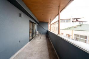 an empty balcony with a chair in a building at Verula City Suites in Trabzon