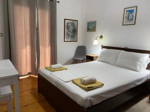 Postel nebo postele na pokoji v ubytování Alexander Apartments