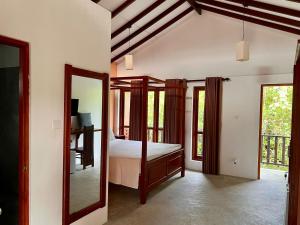 Postel nebo postele na pokoji v ubytování Bali Villa Mirissa