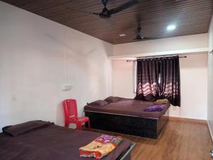 Postel nebo postele na pokoji v ubytování Hemprabha Bed & Breakfast, Ratnagiri