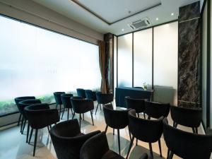 a waiting room with chairs and a large window at Patong Bay Residence in Patong Beach +120 photos