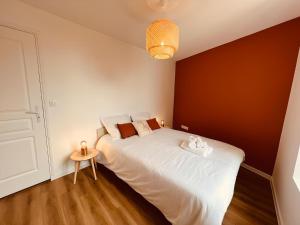 Łóżko lub łóżka w pokoju w obiekcie Le Cocoon - Home Homy