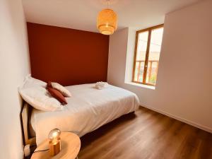Łóżko lub łóżka w pokoju w obiekcie Le Cocoon - Home Homy