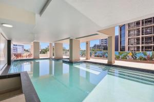 The swimming pool at or close to 2-Bed City Abode with Swimming Pool Gym & Views