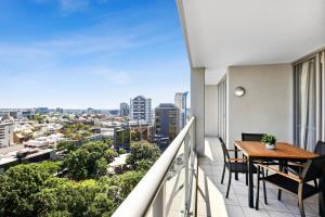 A balcony or terrace at 2-Bed City Abode with Swimming Pool Gym & Views