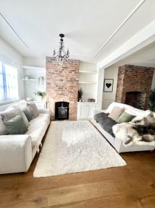 a living room with a couch and a fireplace at City Chester Entire House Central in Chester