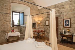 Postel nebo postele na pokoji v ubytování Torre dei Belforti
