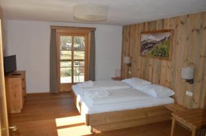 Postel nebo postele na pokoji v ubytování Ferienhaus Bognerhof