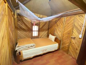 Tempat tidur dalam kamar di Mao Sapa trekking and homestay
