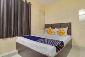 En eller flere senger på et rom på SPOT ON Hotel Sai Manikanta palace