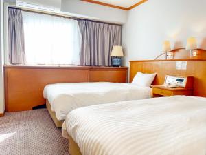 Letto o letti in una camera di Hotel Castle Inn Ise
