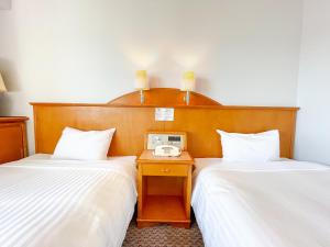 Letto o letti in una camera di Hotel Castle Inn Ise