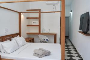 Voodi või voodid majutusasutuse JIRAJIRA HOTEL toas