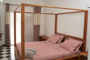 Voodi või voodid majutusasutuse JIRAJIRA HOTEL toas