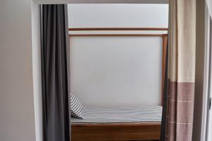 Voodi või voodid majutusasutuse JIRAJIRA HOTEL toas